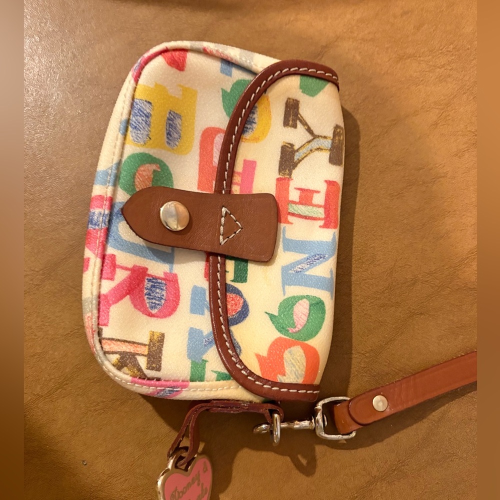 Vintage Dooney & Bourke wristlet. As shown.